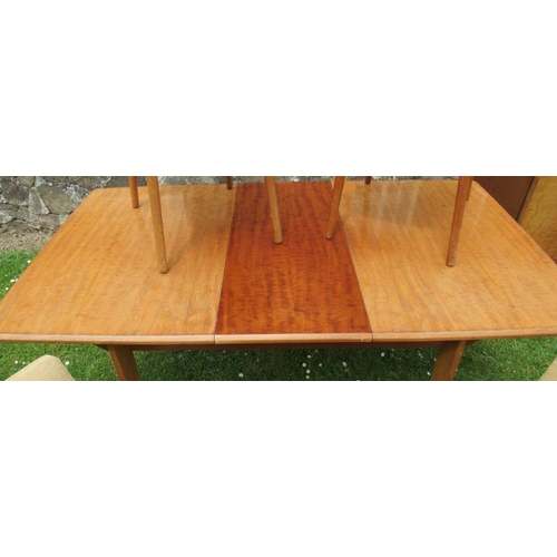 22 - A 20th century extending dining table and four chairs, possibly Golden Key Alfred Cox, table 62.5ins... 