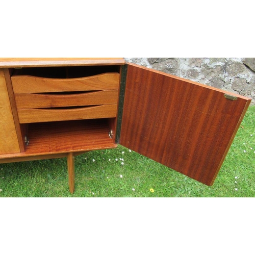 23 - A 20th century Gold Key Alfred Cox sideboard, fitted with a cupboard door revealing drawers and a hi... 