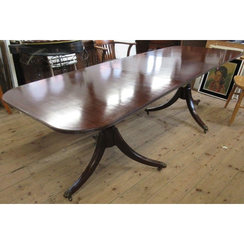 26 - A Regency style reproduction mahogany dining table, raised on pedestals, together with 6 (4+2) dinin... 