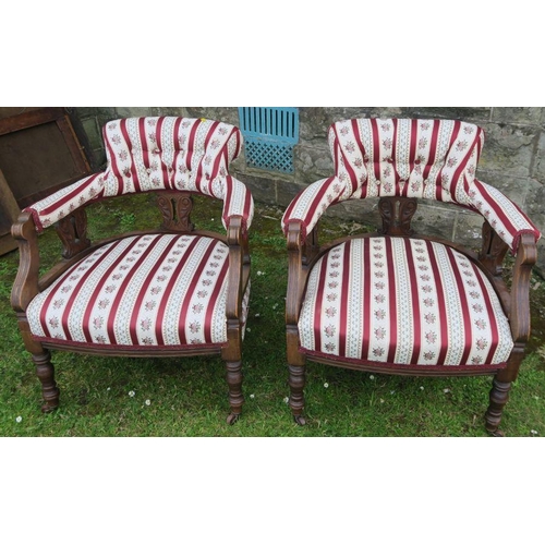 35 - A pair of Edwardian low chairs, with carved decoration