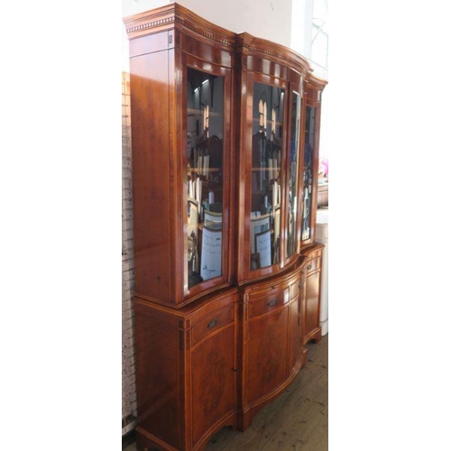 4 - A reproduction yew wood breakfront cabinet, with glazed upper section, fitted with cupboards, drawer... 