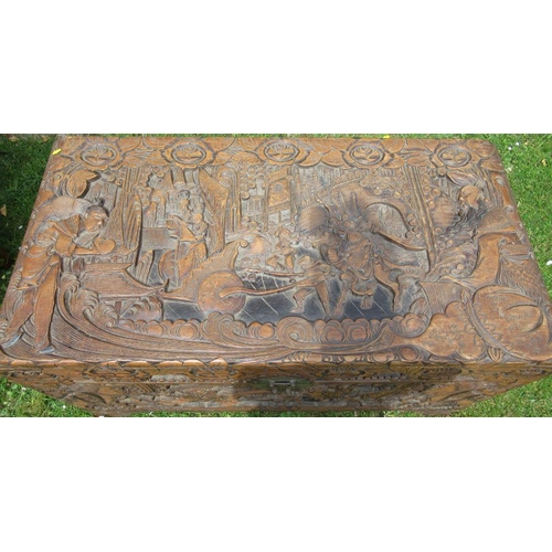 44 - An Eastern carved blanket box, decorated with figures in landscape and flowers, 41ins x 20.5ins, hei... 