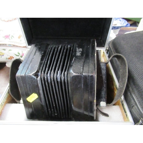 242 - A Wheatstone & Co concertina, numbered 29228, with 58 buttons