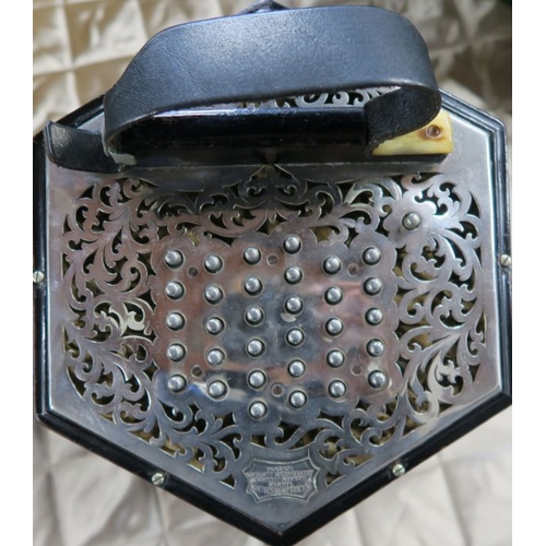 242 - A Wheatstone & Co concertina, numbered 29228, with 58 buttons