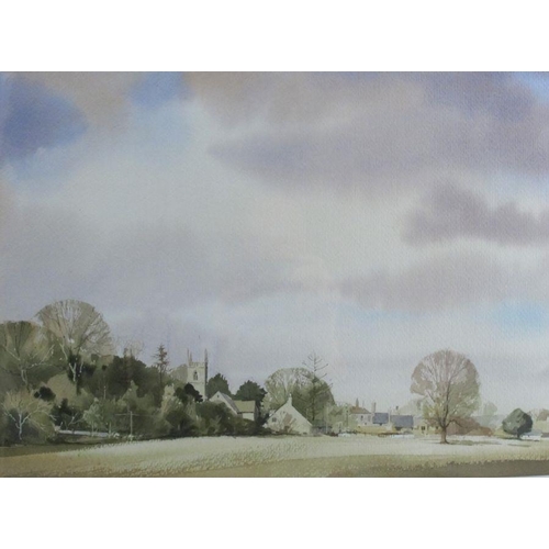 104 - A 20th century English watercolour, view across a field to church and houses, 13ins x 18ins 25324