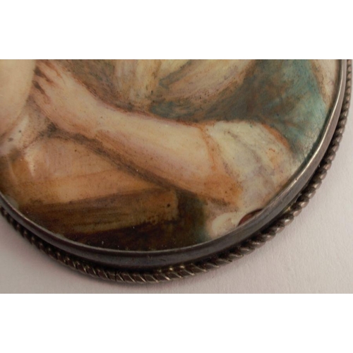 135 - A miniature portrait on ceramic, the reverse monogrammed EM with 1913, the oval panel 6.5cm x 4.7cm