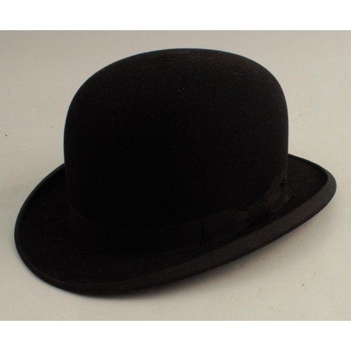 143 - A Falcon black bowler hat, size 71/8