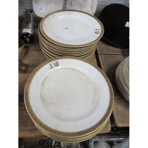 145 - 19 dinner plates, printed with a crest, together with two others