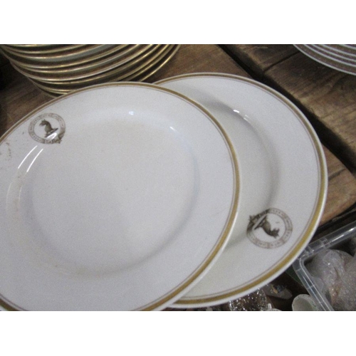 145 - 19 dinner plates, printed with a crest, together with two others