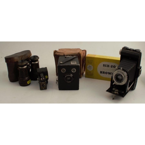 147 - A Coronet Midget camera, with case, together with a Kodak six-20 Brownie Junior, a Kodak Six-20 Brow... 