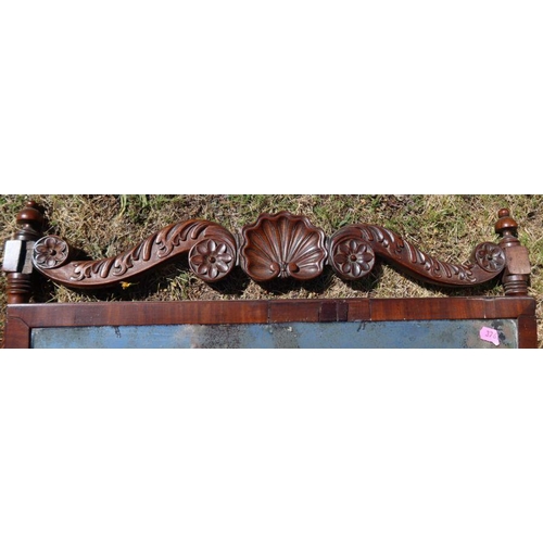 15 - A 19th century mahogany dressing table mirror, with carved top rail over a mirror, raised on turned ... 