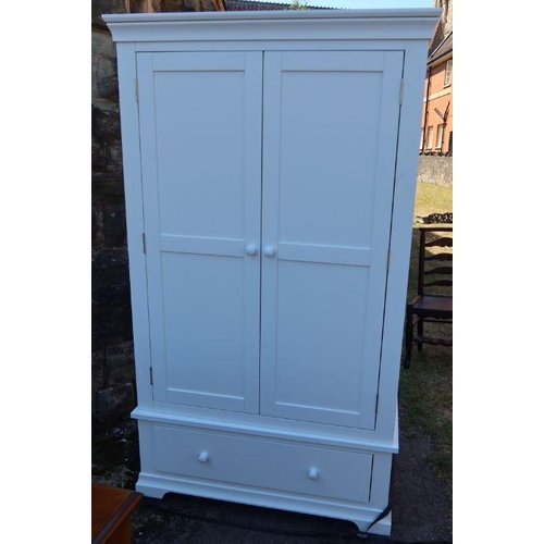 16 - A Cotswold Company modern white panelled wardrobe, fitted with a pair of cupboard doors and drawer t... 