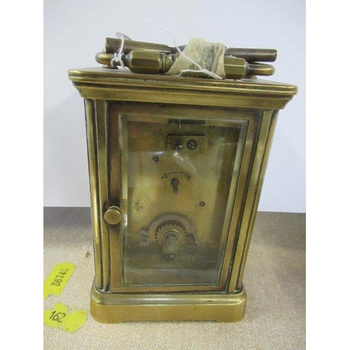 176 - A brass cased carriage clock, together with a pair of Christofle France dishes