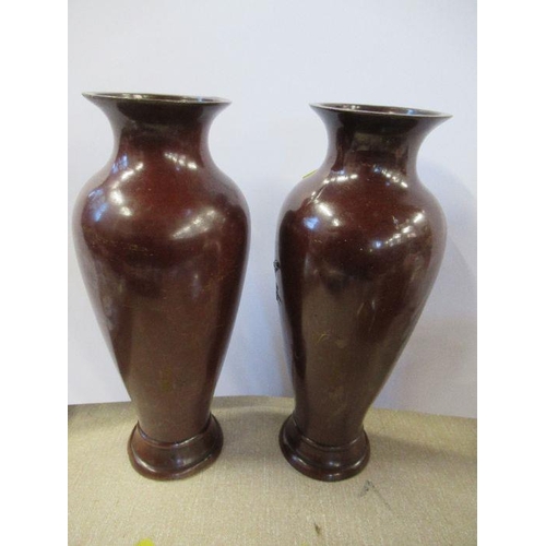 177 - A pair of Eastern metal vases, of baluster form, decorated with birds, height 9ins