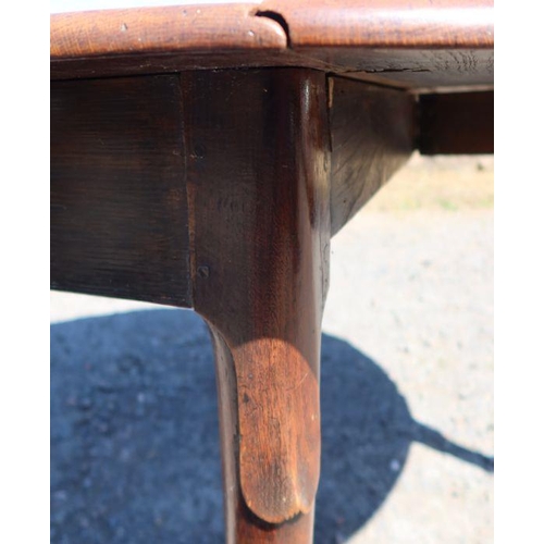 19 - An antique oak gateleg dining table, of oval form, with swing leg action, raised on pad feet, 53ins ... 