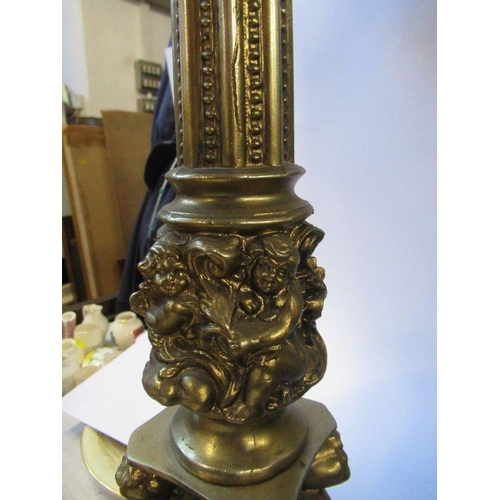 193 - A gilt table lamp, decorated with cherubs