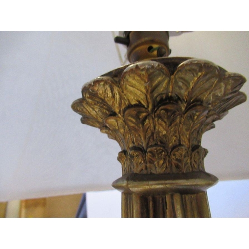 193 - A gilt table lamp, decorated with cherubs