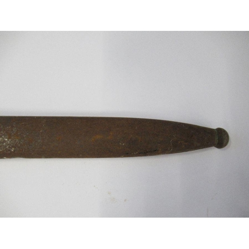 196 - A bayonet with metal scabbard, fullered blade and stud work to the wooden handle