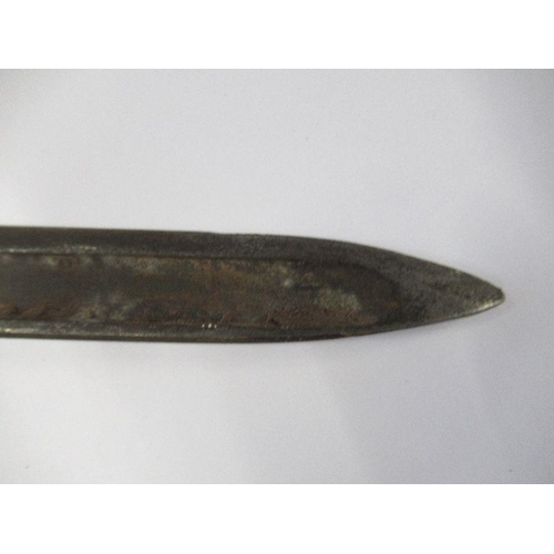 196 - A bayonet with metal scabbard, fullered blade and stud work to the wooden handle