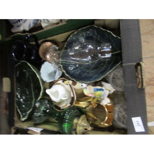 203 - A box of assorted ceramics and green pressed glass oil lamp bas with clear glass chimney