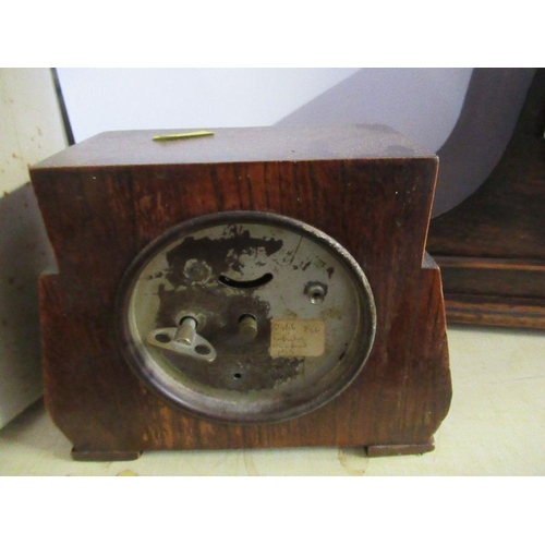 216 - An oak cased mantel clock, together with another mantel clock