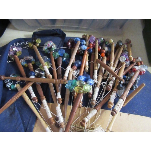 219 - A collection of lace makers wooden bobbins, with bead decoration