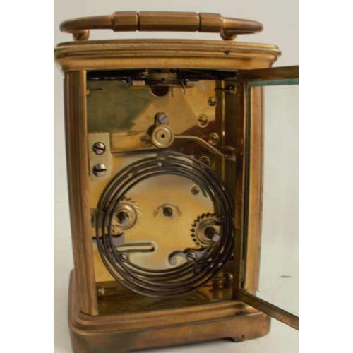 223 - A cased repeating carriage clock, with enamel dial and leather covered travelling case