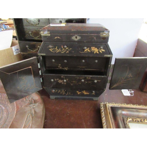 244 - Two Oriental black lacquer table cabinets, fitted with drawers, with gilt decoration