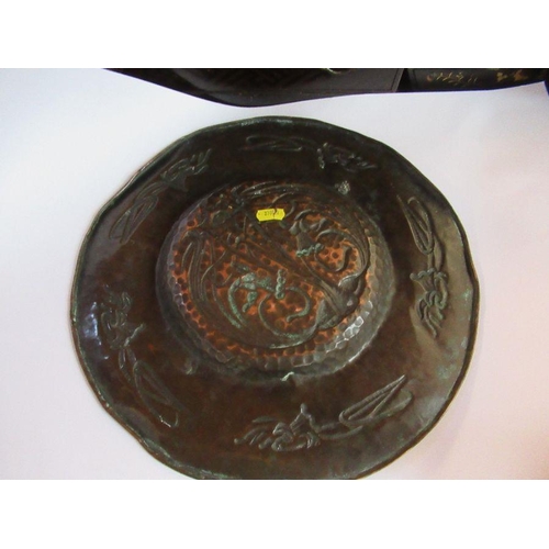 245 - An Arts and Crafts circular copper wall plate, decorated with flowers, diameter 15ins