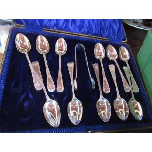 295 - 11 hallmarked silver teaspoons, with bright cut decoration and initial, with matching sugar tongs, c... 