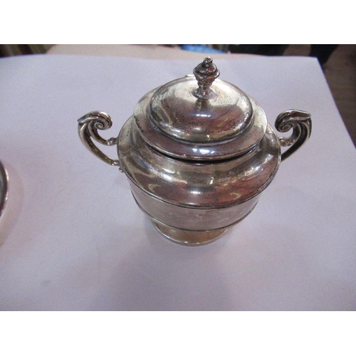 297 - A hallmarked silver urn, with hinged cover pair of handles and raised on a pedestal foot, weight 5oz... 