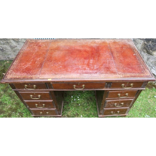 3 - A 19th century knee hole pedestal desk, fitted one long drawer, flanked by a short drawer to each si... 