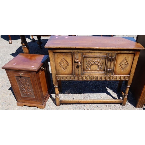 31 - A reproduction oak side cabinet, fitted with a cupboard, having carved decoration, 36ins x 13ins x h... 