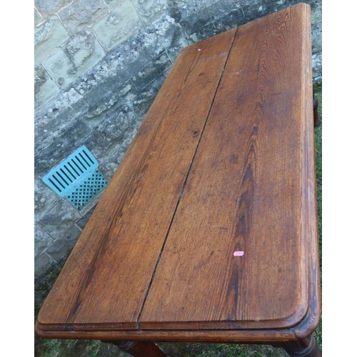 34 - An antique pine kitchen table, fitted with an end drawer, raised on turned legs, 74ins x 31.5ins x h... 