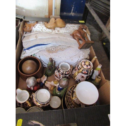 351 - A box of assorted linen and china to include Imari pattern items