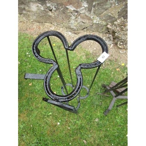 53 - A companion set, together with stylised horseshoe stick stand