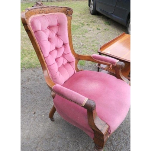 57 - A Victorian mahogany showwood open armchair, with carved decoration and button back