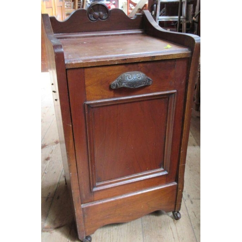 68 - An Edwardian mahogany coal perdonium, with carved decoration