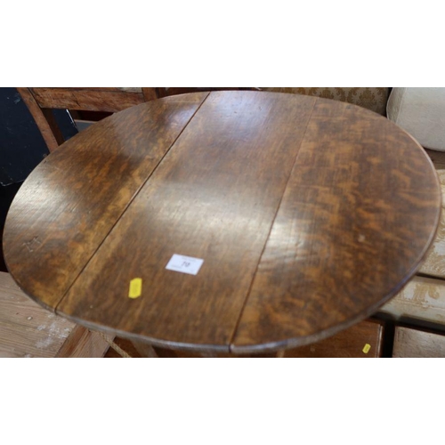 70 - A small oak drop flap table, diameter 23.5ins, height 23ins