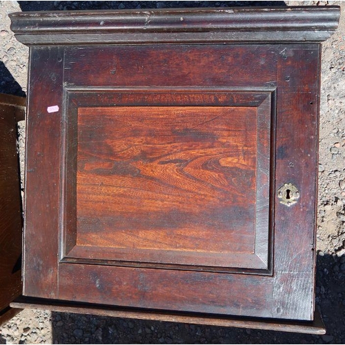 1 - An antique oak wall cupboard, the panelled door opening to reveal shelves and a small drawer, 25ins ... 