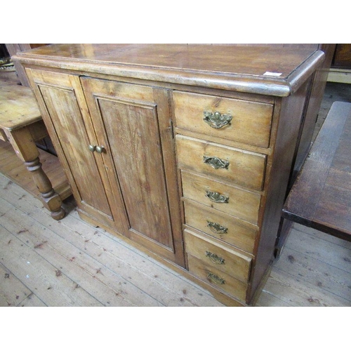 10 - A pine chest, fitted two cupboard doors, flanked to the righthand side by six short drawers, width 5... 