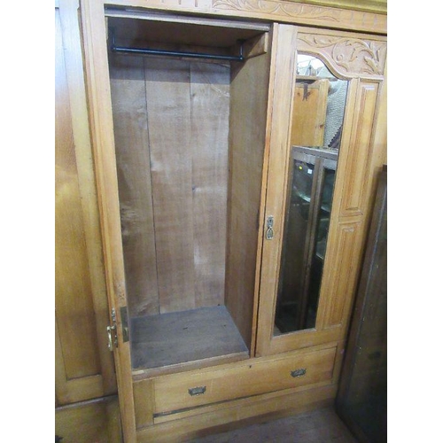 103 - A double mirror door wardrobe, satinwood. Width 45 ins, height 83 ins.