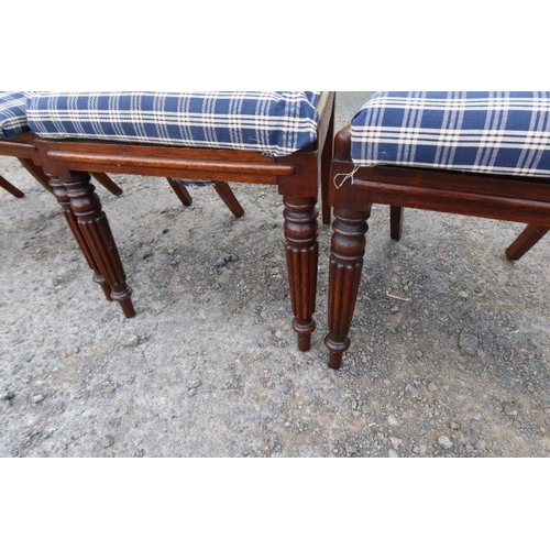 113 - A set of four Regency design dining chairs, with tulip bar back, raised on reeded front legs