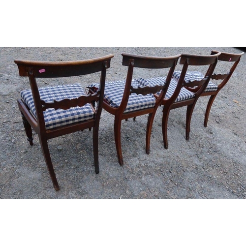 113 - A set of four Regency design dining chairs, with tulip bar back, raised on reeded front legs