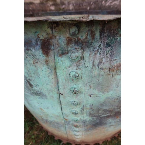 115 - A large rivetted copper bin, diameter 36ins x height 27ins