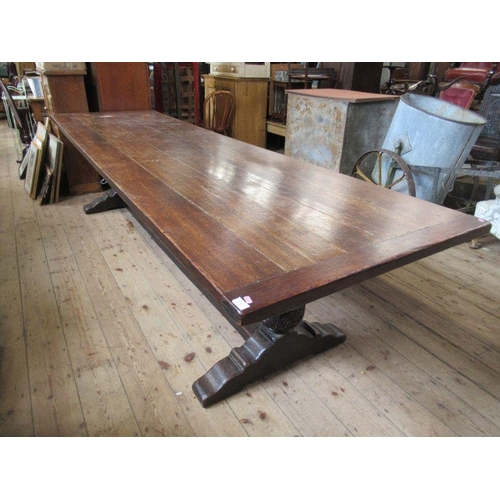 12 - A large oak refectory table, having five plank cleated top, width 36ins, height 29.5ins, length 126i... 