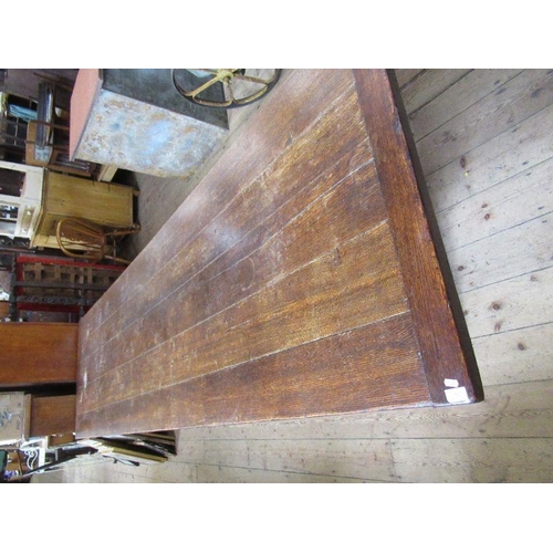 12 - A large oak refectory table, having five plank cleated top, width 36ins, height 29.5ins, length 126i... 