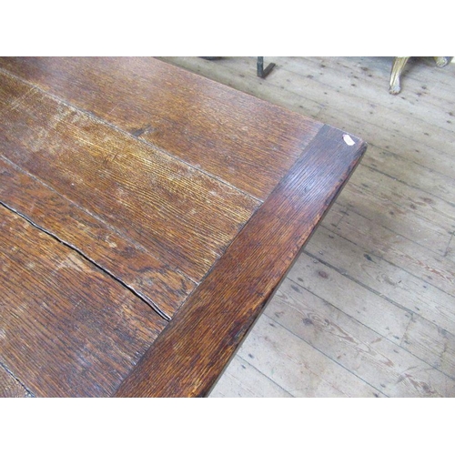 12 - A large oak refectory table, having five plank cleated top, width 36ins, height 29.5ins, length 126i... 