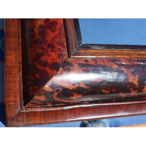 139 - A 17th century style tortoiseshell and mahogany cushion framed wall mirror, overall dimensions 24ins... 