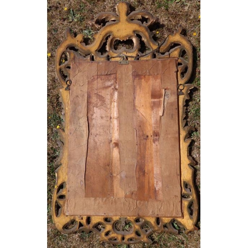 141 - An antique gilt framed wall mirror, the rectangular plate with leaf and scroll frame, overall dimens... 